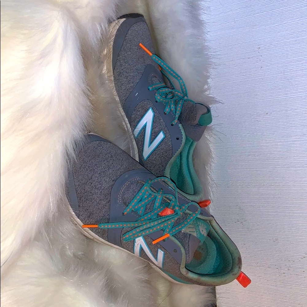 Nike tennis shoes. grey w/ orange and blue detail